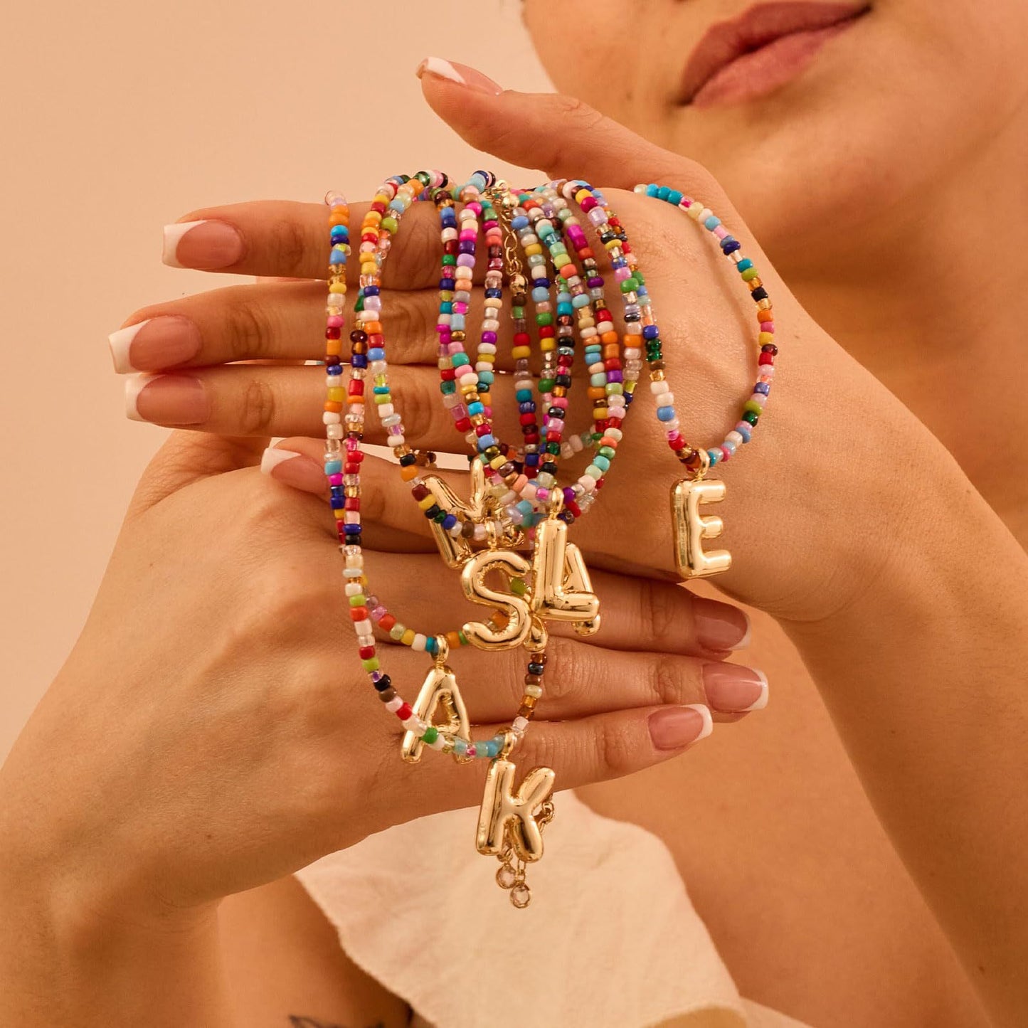 Colored rice bead letter pendant